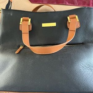 Woman’s brand new black purse